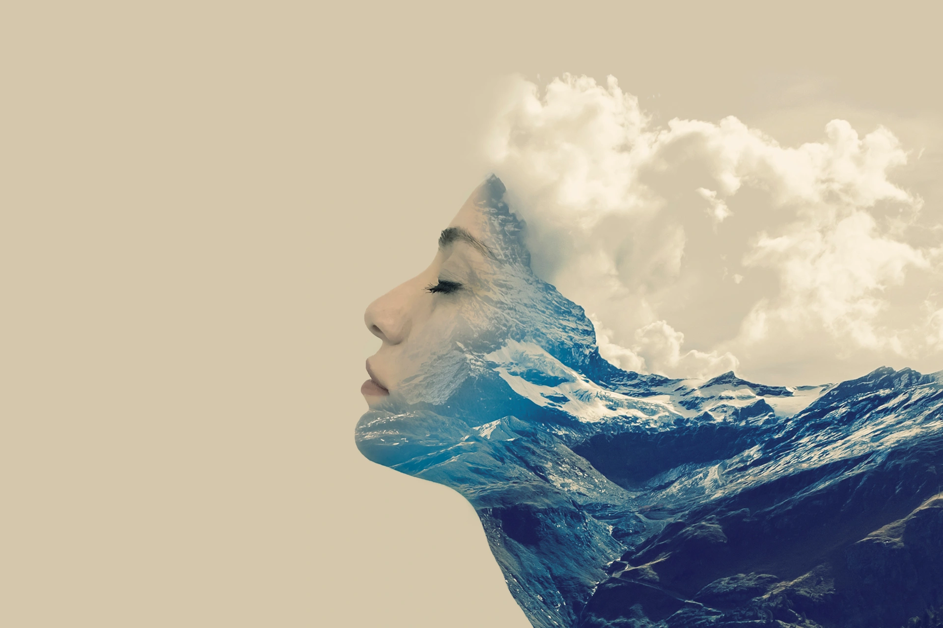 A woman in profile blended with a mountain landscape